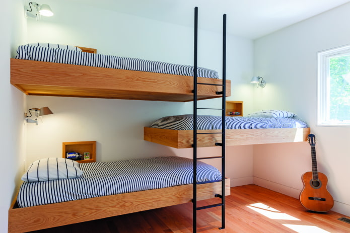 Interior de dormitorio para tres niños