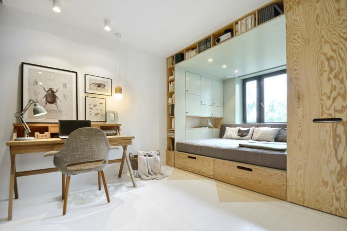 cama con cajones empotrados junto a la ventana en una habitación infantil pequeña