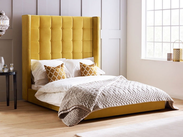 Cama con cabecero alto