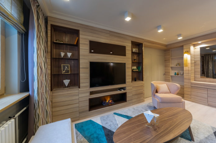 Chimenea con TV integrada en el mueble del salón