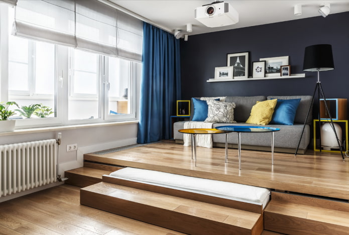 Podio con cama extraíble en el interior