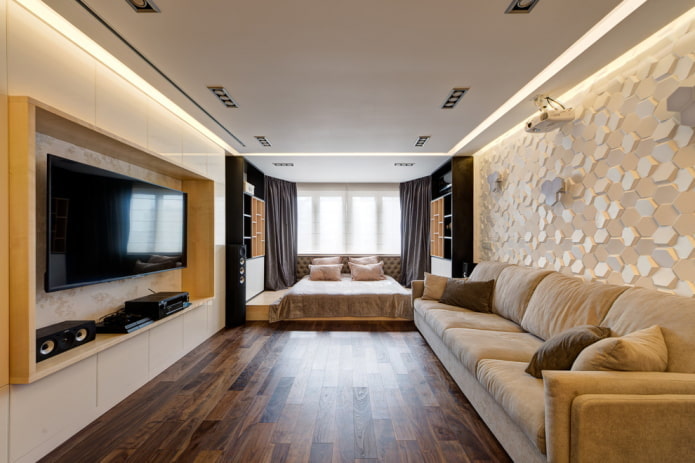 cama en la sala de estar, junto al ventanal