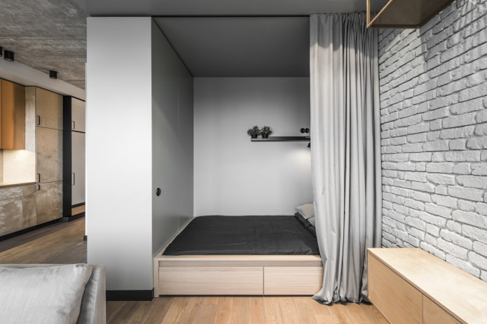 nicho con cama en un interior de estilo loft