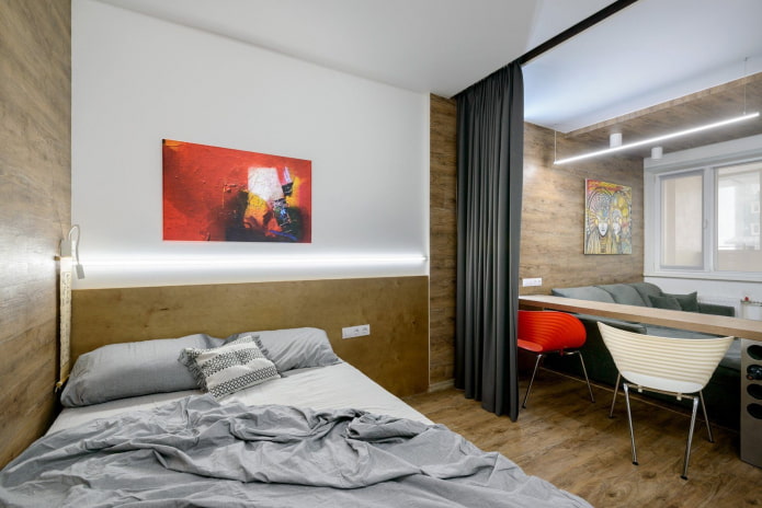 cama y sofá en un apartamento de una habitación