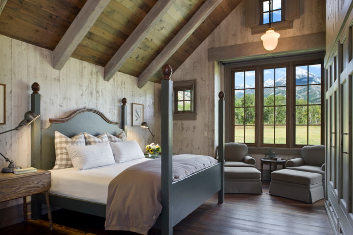 cama gris en el interior del dormitorio