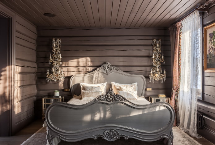 cama gris en el interior del dormitorio