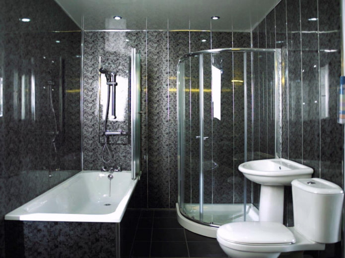 baño acabado con paneles de plástico negro