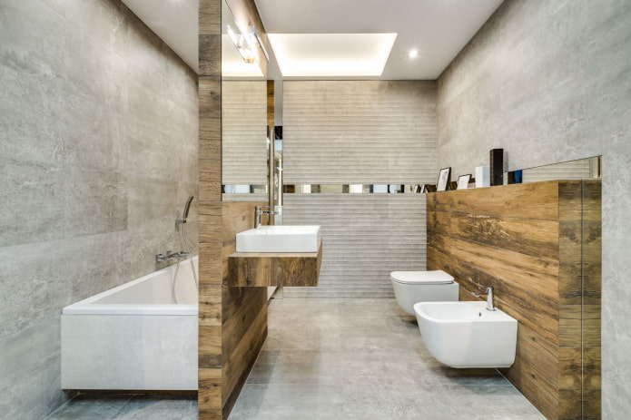 Combinación de azulejos de madera con hormigón en el interior del baño