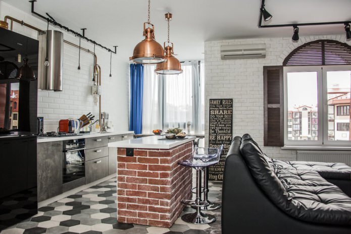 Diseño de cocina-salón con barra de bar con base de ladrillo