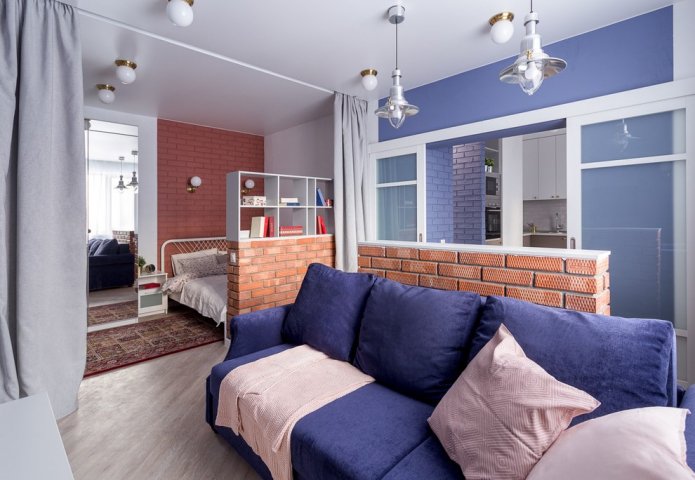 Zonificación con cortinas en el interior del dormitorio-salón