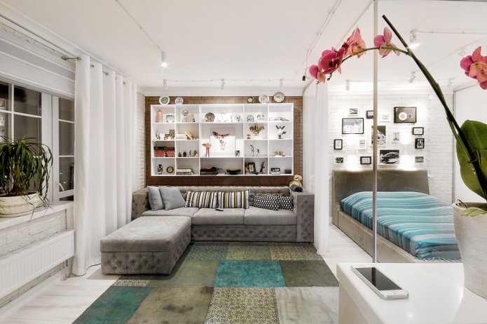 diseño del dormitorio combinado con una sala de estar