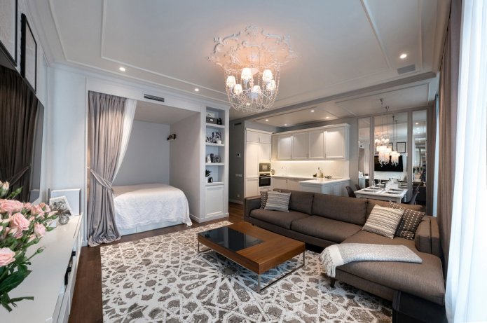 diseño del dormitorio combinado con una sala de estar