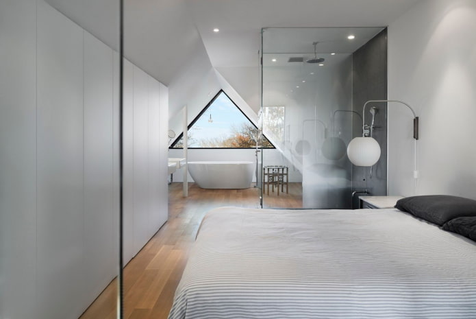 diseño de un dormitorio abuhardillado con baño