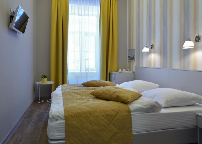 dormitorio gris con detalles brillantes