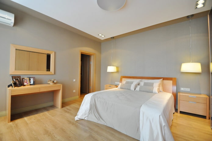 Interior de dormitorio en gris y beige
