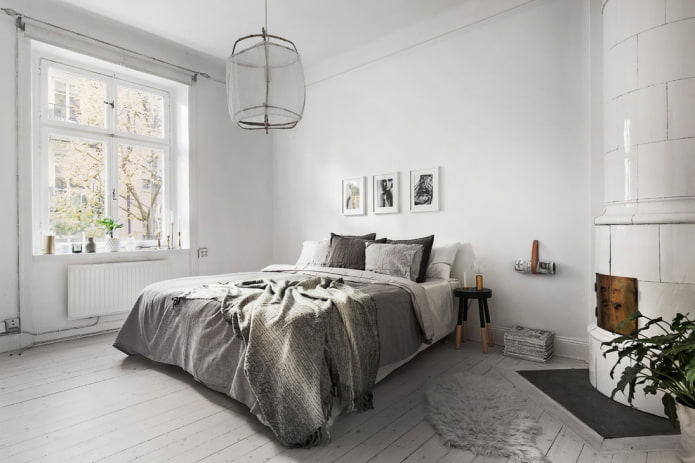 paredes blancas y cama gris