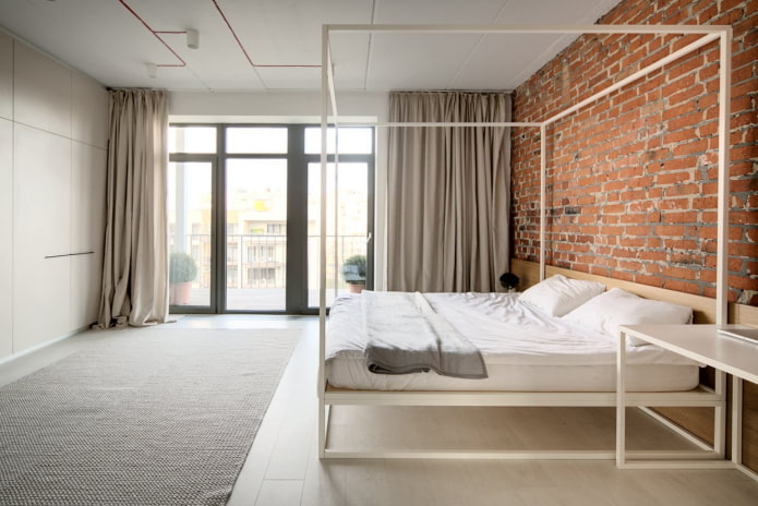 Dormitorio de estilo industrial con elementos minimalistas