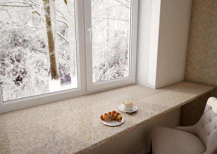 Alféizar de ventana que se convierte en una mesa de piedra