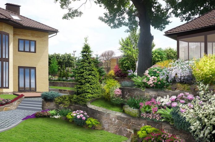 Jardín de flores de varios niveles cerca de una casa de campo