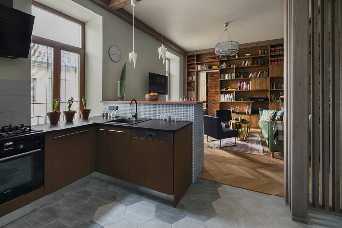Zonificación con materiales de acabado en el interior de la cocina-salón