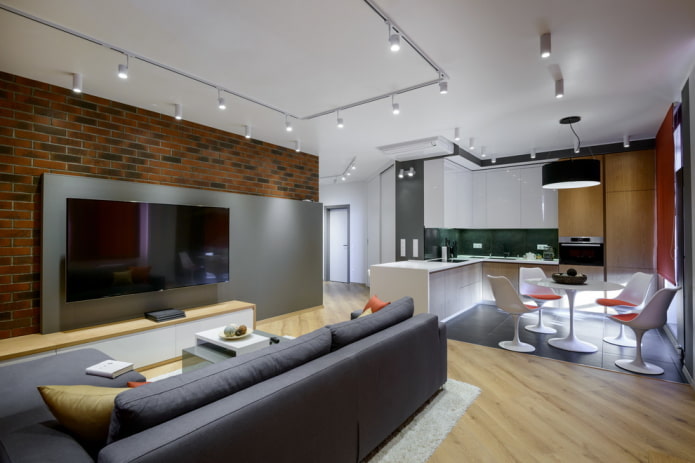 Zonificación con materiales de acabado en el interior de la cocina-salón