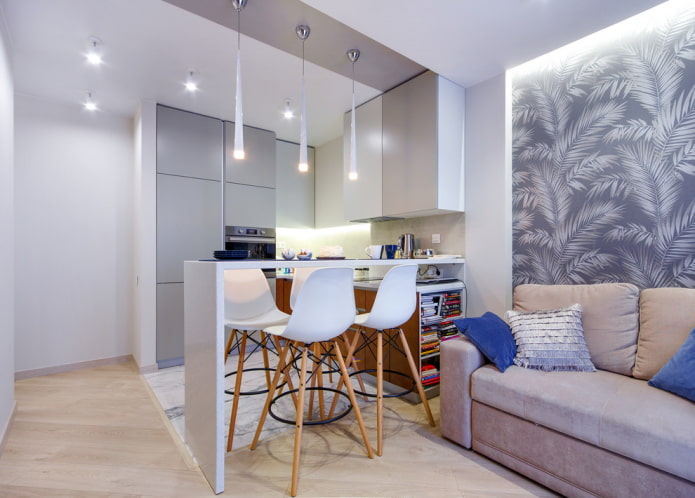 Zonificación con materiales de acabado en el interior de la cocina-salón